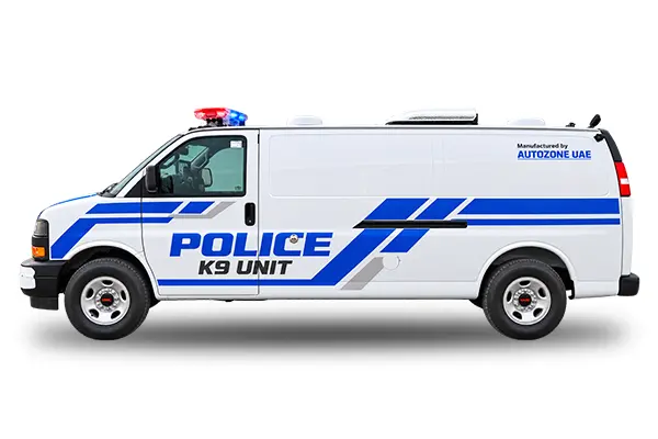 Side view of a GMC Savana police K9 unit van with blue livery and roof mounted beacons